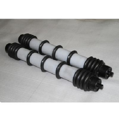 Self cleaning return idlers