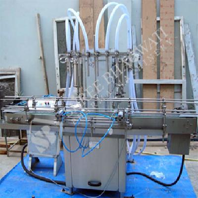 Four Head Volumetric Liquid Filling Machine