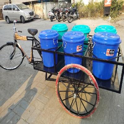 garbage collecting tricycle green